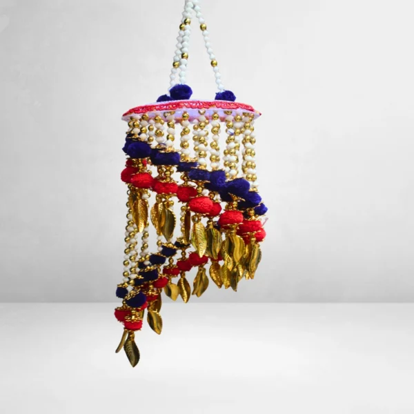 handmade-spiral-beaded-jhumar-with-red-blue-pom-poms-and-golden-leaf-danglers.webp