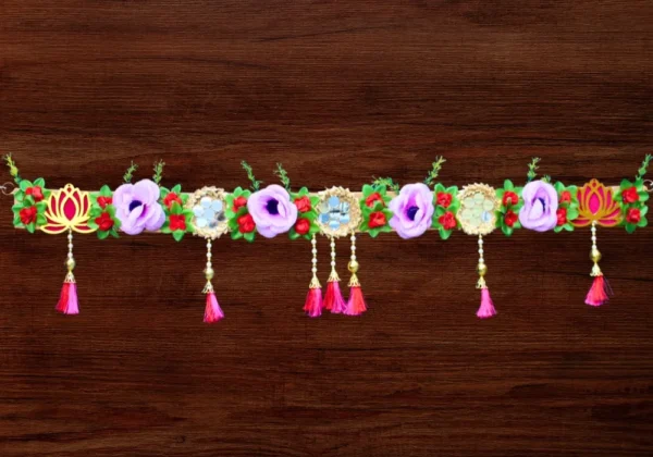 lotus-floral-toran-with-purple-roses-and-golden-tassels.webp