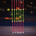 red-green-pompom-diwali-latkan-with-swastik-golden-ganti-door-hanging.webp